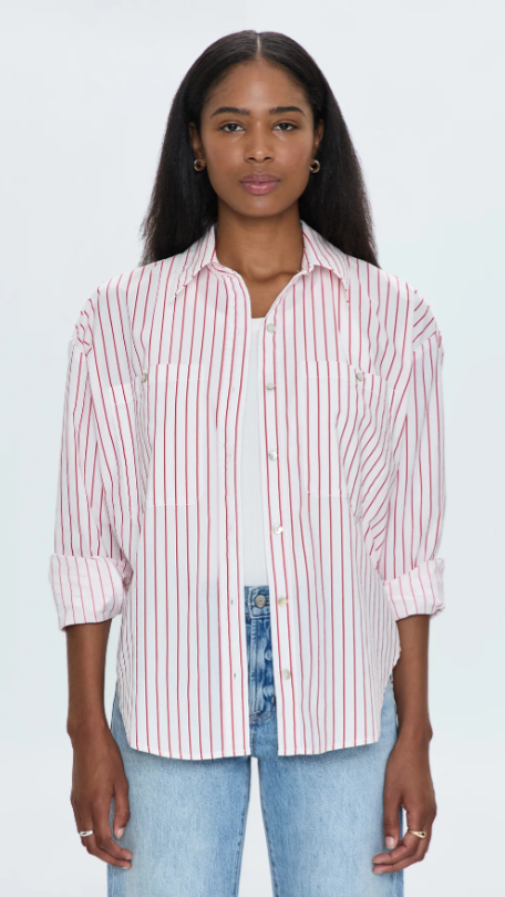 Pistola Samantha Button Up, Relaxed button up shirt with a boyfriend-inspired fit and feel. Front button chest pockets, collared neckline, and cuffed sleeves. Offered in a classic oxford white decorated with red wide vertical striping.
Length: 28 1/2”
• Model is 5’9” wearing size Small
• 55% Cotton / 45% Rayon