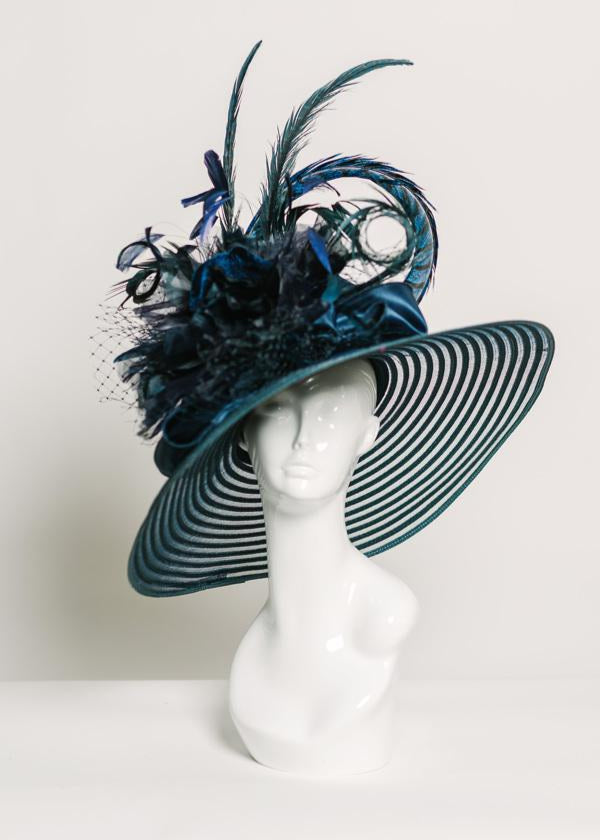 Navy hat with large navy velvet & silk flower, navy satin ribbon, navy hackle feathers, navy coque tip feathers, navy & blue pheasant feathers, navy netting, kentucky derby hat