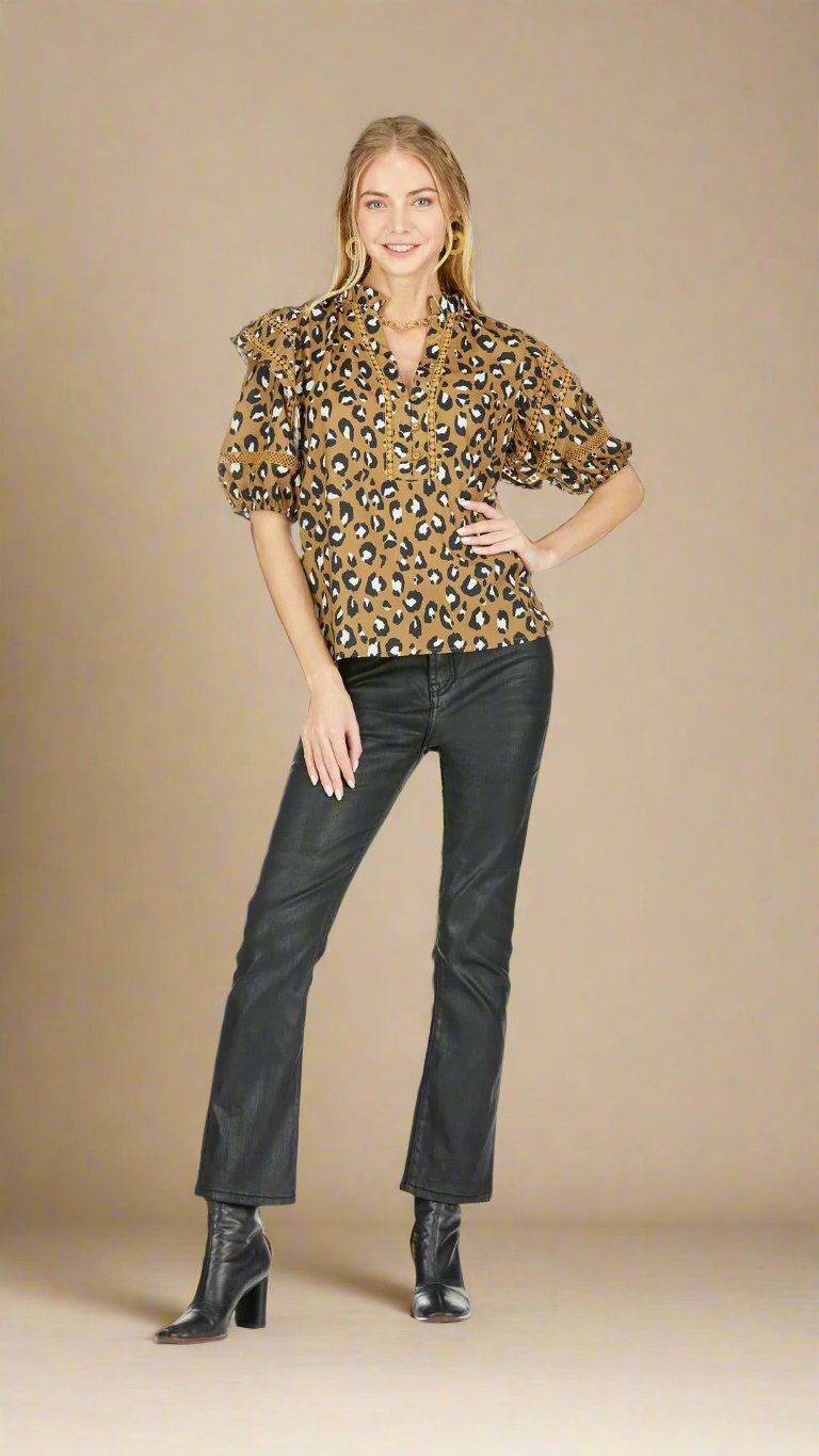 For the fashionista who likes to take a walk on the wild side, the Leopard-Licious Top boasts a puffed sleeve, v-neckline, and neutral color palette.