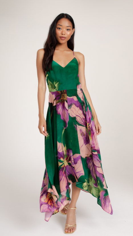 Women's spring cocktail attire, sleeveless asymetrical midi dress with green bodice and purple floral print